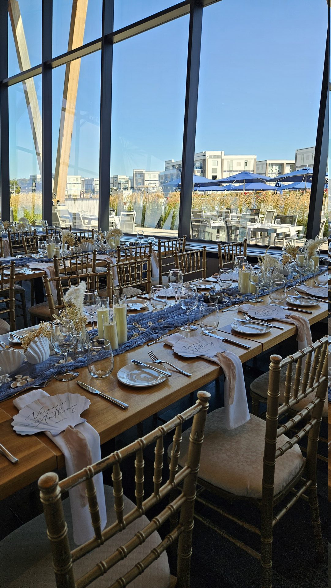 Elegant wedding reception with centerpiece arrangements - Petal & Pearl Decor